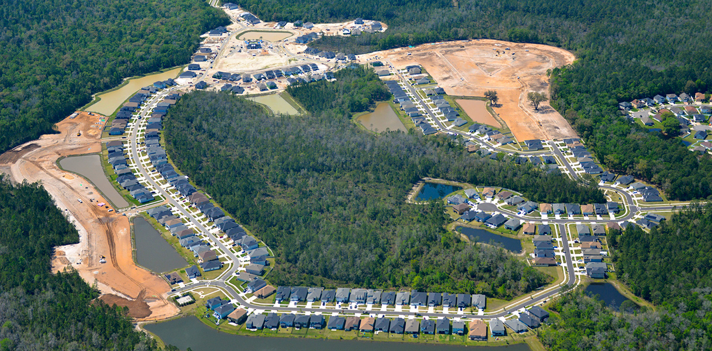 An aerial view of a newly built development consisting of single-family homes